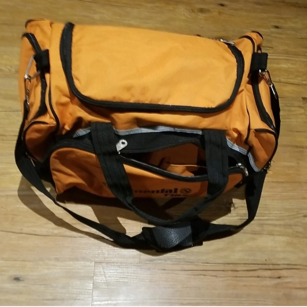 Multiple zippered pocket duffle bag NWT